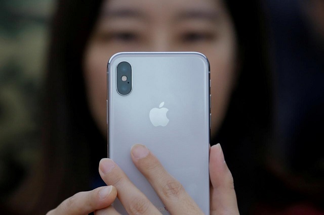 a attendee uses a new iphone x during a presentation for the media in beijing china october 31 2017 photo reuters