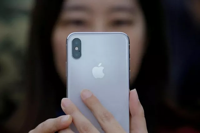 a attendee uses a new iphone x during a presentation for the media in beijing china october 31 2017 photo reuters a attendee uses a new iphone x during a presentation for the media in beijing china october 31 2017 photo reuters