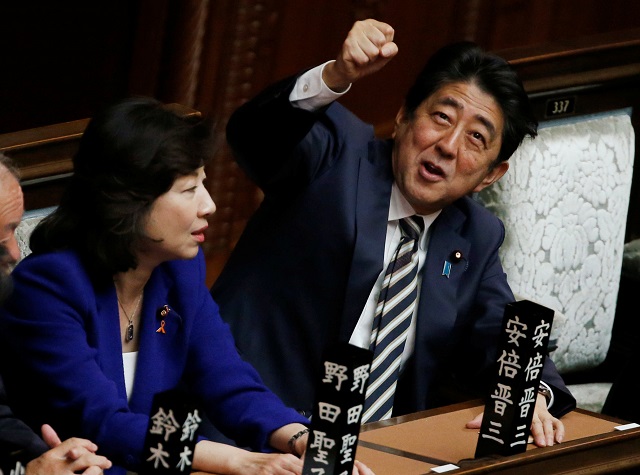 japan 039 s prime minister shinzo abe r gestures as he talks with ruling liberal democratic party lawmaker seiko noda at the lower house of the parliament in tokyo japan november 1 2017 photo reuters