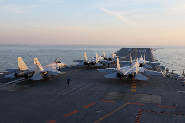 this file picture taken on an undisclosed date in december 2016 shows chinese j 15 fighter jets waiting on the deck of the liaoning aircraft carrier during military drills in the bohai sea off china 039 s northeast coast photo afp