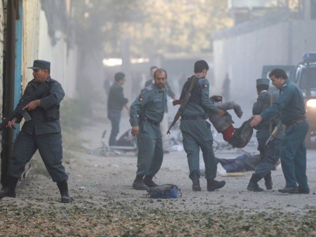 afghan police carry away a victim after a blast in a diplomatic zone of kabul on october 31 photo reuters