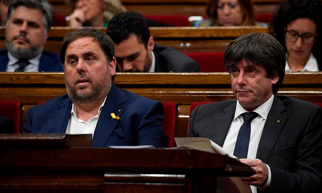 catalan president carles puigdemont right and former vice president oriol junqueras attend a session at the catalan parliament in barcelona photo afp