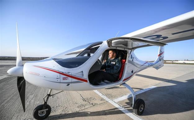 a pilot checks the rx1e a a two seater aircraft designed by shenyang aerospace university at caihu airport in shenyang capital of northeast china 039 s liaoning province photo courtesy china daily