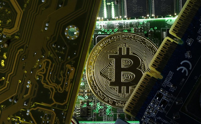 a copy of bitcoin standing on pc motherboard is seen in this illustration picture october 26 2017 picture taken october 26 2017 photo reuters