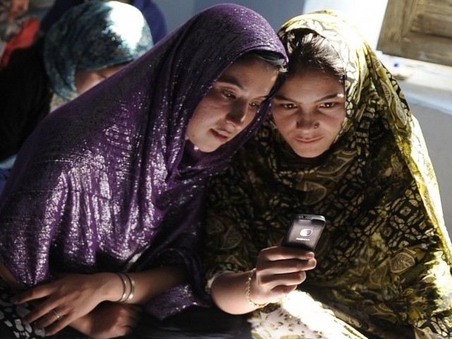 afghan women sit in a class and study using mobile phones in kabul on november 3 photo afp