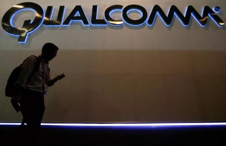 a man walks past qualcomm stand while attending the mobile world congress in barcelona march 3 2015 photo reuters a man walks past qualcomm stand while attending the mobile world congress in barcelona march 3 2015 photo reuters