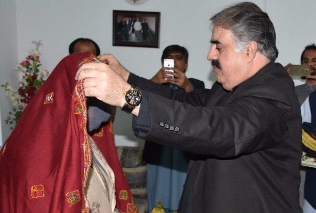 balochistan chief minister nawab sanaullah khan zehri covers the head with traditional shawl of one of the family members of dr allah nazar released by the security forces on november 3 2017 photo inp balochistan chief minister nawab sanaullah khan zehri covers the head with traditional shawl of one of the family members of dr allah nazar released by the security forces on november 3 2017 photo inp