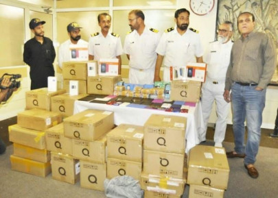 80 000 smuggled cell phones seized in raid at bungalow in karachi s defence