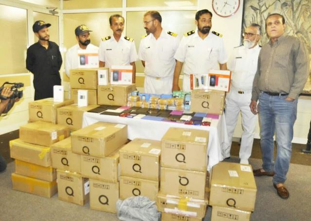 80 000 smuggled cell phones seized in raid at bungalow in karachi s defence