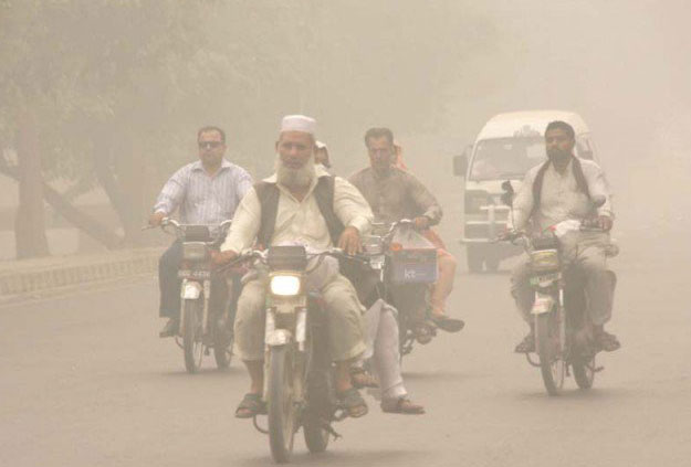 motorists drive through a thick blanket of fog early in the morning photo app file