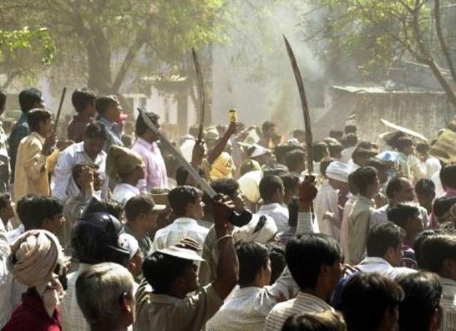 human rights groups say more than 2 000 people mainly muslims were hacked beaten or burned to death during the riots photo afp file