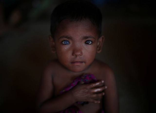 hosne ara 4 a rohingya refugee who fled myanmar two months ago listens to children singing at a children 039 s centre in the kutupalong refugee camp near cox 039 s bazar bangladesh photo reuters
