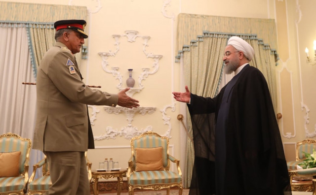 iranian president hassan rowhani greets army chief general qamar javed bajwa in tehran on november 6 2017 photo afp iranian president hassan rowhani greets army chief general qamar javed bajwa in tehran on november 6 2017 photo afp