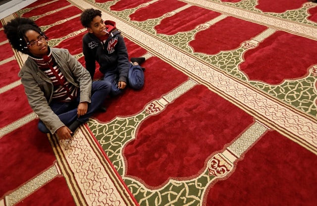 two boys part of a group of hungarians visiting a mosque to learn about the muslim community in budapest look on budapest hungary november 3 2017 photo reuters two boys part of a group of hungarians visiting a mosque to learn about the muslim community in budapest look on budapest hungary november 3 2017 photo reuters
