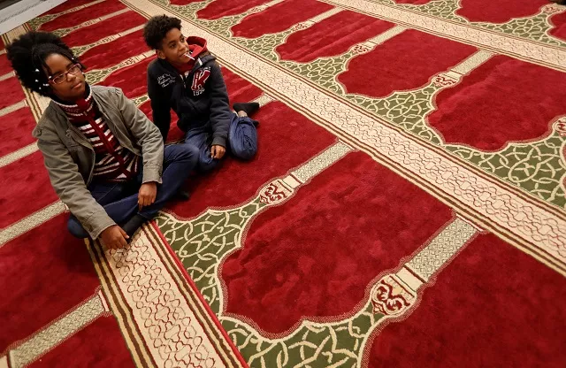 two boys part of a group of hungarians visiting a mosque to learn about the muslim community in budapest look on budapest hungary november 3 2017 photo reuters two boys part of a group of hungarians visiting a mosque to learn about the muslim community in budapest look on budapest hungary november 3 2017 photo reuters