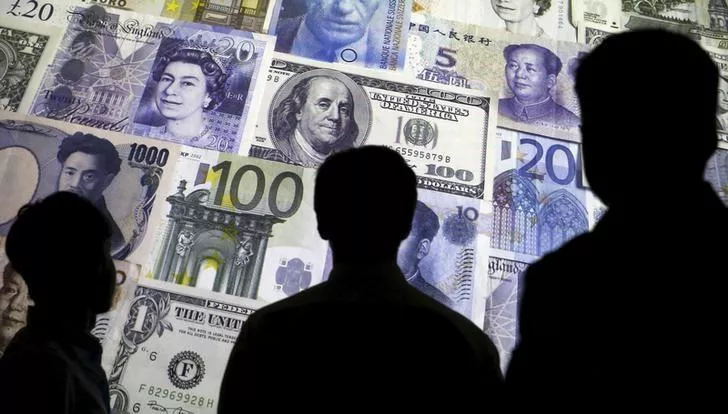 people are silhouetted against a backdrop projected with the picture of various currencies of money in this illustration taken april 4 2016 photo reuters people are silhouetted against a backdrop projected with the picture of various currencies of money in this illustration taken april 4 2016 photo reuters