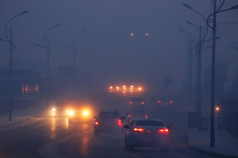 cars drive through the thick haze photo reuters