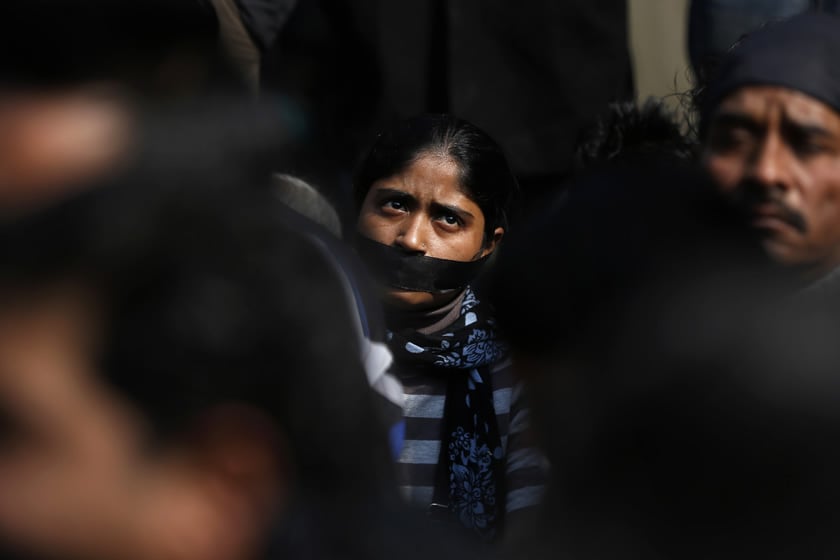 a protester with a gag tied around her mouth takes part in a silent protest for the victim of a gang rape in new delhi india photo reuters