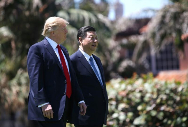 us president donald trump l and china 039 s president xi jinping walk along the front patio of the mar a lago estate after a bilateral meeting in palm beach florida u s april 7 2017 photo reuters us president donald trump l and china 039 s president xi jinping walk along the front patio of the mar a lago estate after a bilateral meeting in palm beach florida u s april 7 2017 photo reuters