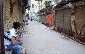 closed for business a young man sits outside a closed wholesale drugs and chemist market after the market was sealed in raids on medical stores due to alleged sale of expired drugs in hyderabad photo online