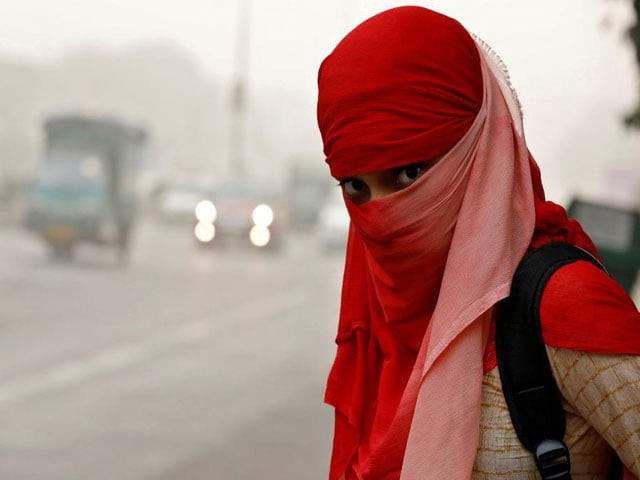 a woman wearing a scarf to cover her face looks on as she waits for a passenger bus on a smoggy morning in new delhi india november 8 2017 photo reuters a woman wearing a scarf to cover her face looks on as she waits for a passenger bus on a smoggy morning in new delhi india november 8 2017 photo reuters