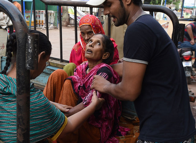 a man shifts a heatwave victim to a hospital in karachi on june 22 2015 photo file