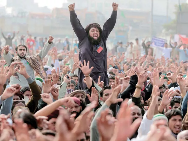members of the tehreek e labaik pakistan shout slogans in islamabad photo reuters members of the tehreek e labaik pakistan shout slogans in islamabad photo reuters
