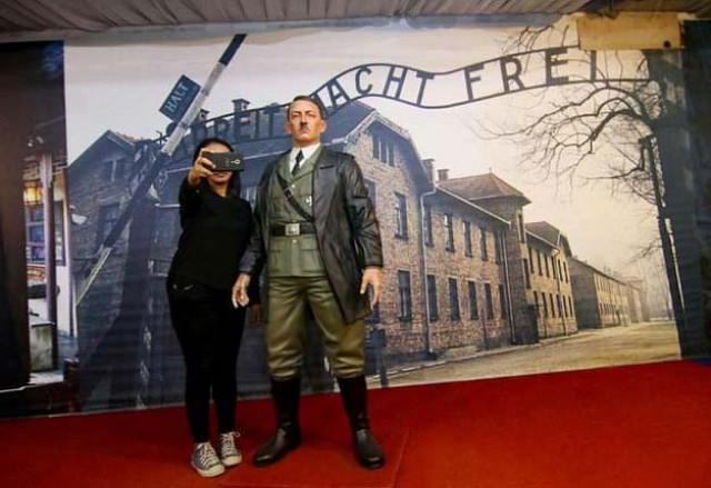 an indonesian lady takes a selfie with a life size wax sculpture of adolf hitler photo afp an indonesian lady takes a selfie with a life size wax sculpture of adolf hitler photo afp