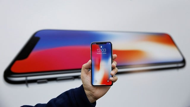 an attendee holds a new iphone x during a presentation for the media in beijing china photo reuters an attendee holds a new iphone x during a presentation for the media in beijing china photo reuters