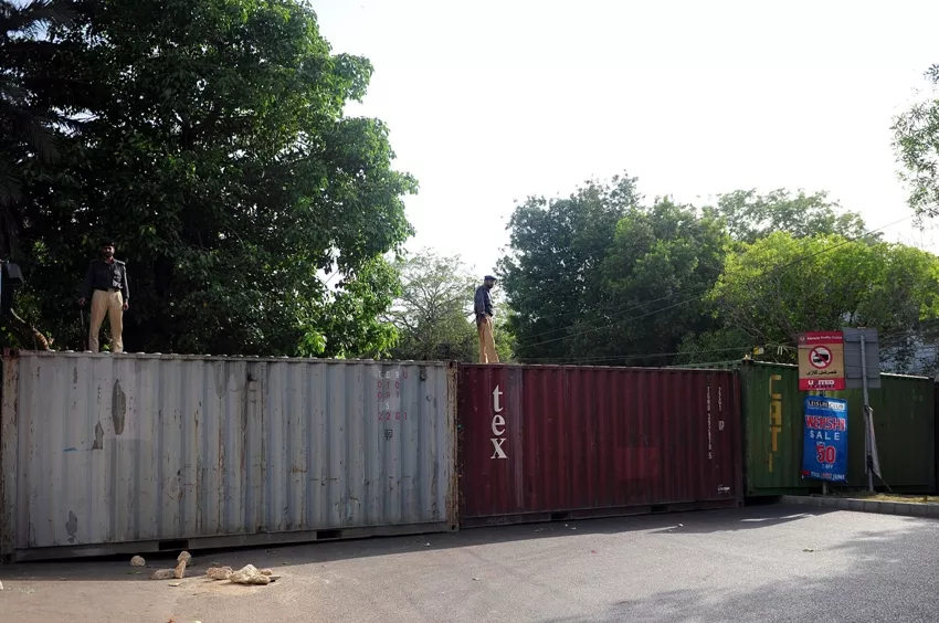 policemen stand guard on containers placed by authorities in front of the british consulate in karachi on june 3 2014 following the arrest of altaf hussain in london photo afp policemen stand guard on containers placed by authorities in front of the british consulate in karachi on june 3 2014 following the arrest of altaf hussain in london photo afp