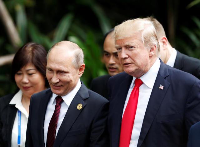 us president donald trump and russia 039 s president vladimir putin talk during the family photo session at the apec summit in danang vietnam november 11 2017 photo reuters