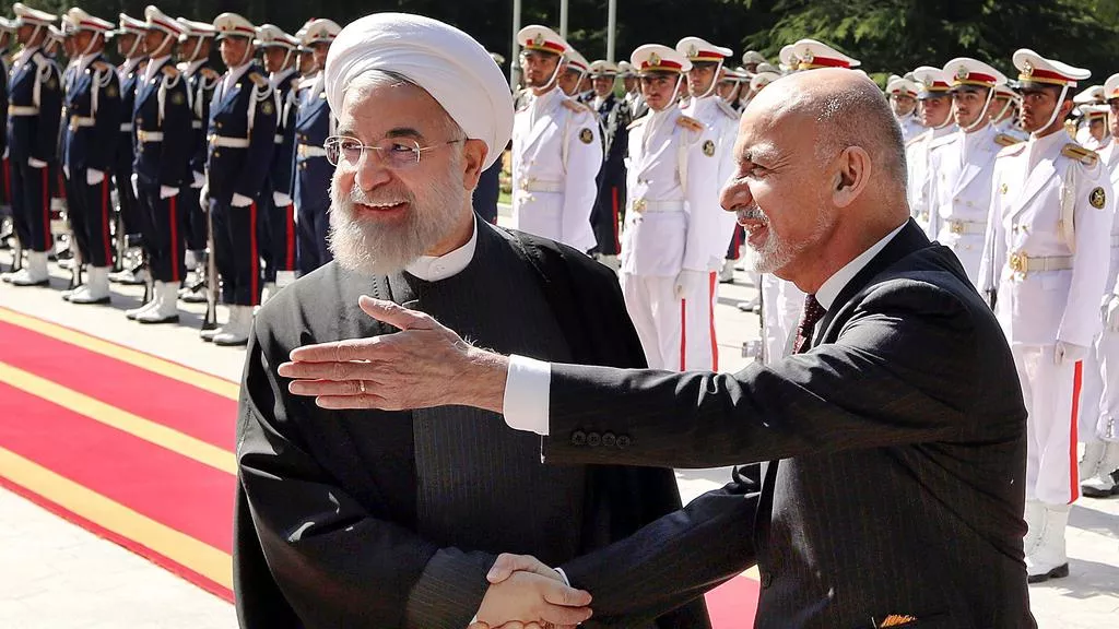 iranian president hassan rouhani left shakes hands with afghan president ashraf ghani during an official welcoming ceremony in tehran photo afp iranian president hassan rouhani left shakes hands with afghan president ashraf ghani during an official welcoming ceremony in tehran photo afp