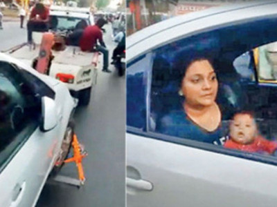 video of mumbai police towing car with woman breastfeeding her baby still inside goes viral video of mumbai police towing car with woman breastfeeding her baby still inside goes viral