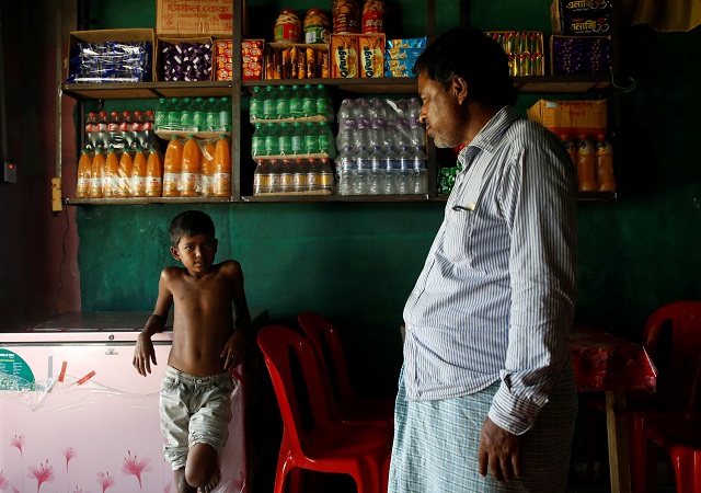 azimul hasan 10 a rohingya refugee boy stands inside a roadside hotel where he works at jamtoli close to palong khali camp near cox 039 s bazar bangladesh november 12 2017 photo reuters