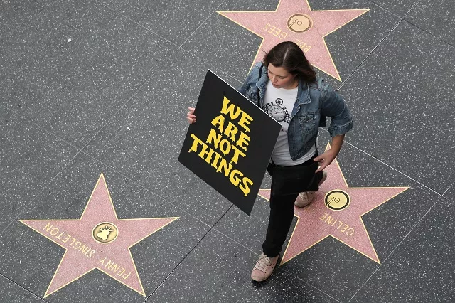 a demonstrator takes part in a metoo protest march for survivors of sexual assault and their supporters on the hollywood walk of fame in hollywood los angeles california u s november 12 2017 photo reuters a demonstrator takes part in a metoo protest march for survivors of sexual assault and their supporters on the hollywood walk of fame in hollywood los angeles california u s november 12 2017 photo reuters