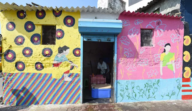 this photo taken on november 9 2017 shows a fisherman packing crates of fish with ice at his shop with the walls painted for the st art festival at sassoon dock one of the oldest fishing docks in mumbai photo afp this photo taken on november 9 2017 shows a fisherman packing crates of fish with ice at his shop with the walls painted for the st art festival at sassoon dock one of the oldest fishing docks in mumbai photo afp