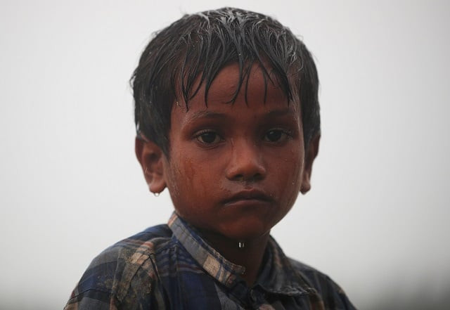 nur kabir 5 a rohingya refugee boy stands in the rain as he waits to receive permission from the bangladeshi army to continue his way after crossing the bangladesh myanmar border at a port in teknaf bangladesh october 31 2017 photo reuters nur kabir 5 a rohingya refugee boy stands in the rain as he waits to receive permission from the bangladeshi army to continue his way after crossing the bangladesh myanmar border at a port in teknaf bangladesh october 31 2017 photo reuters
