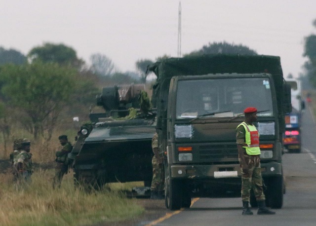 soldiers stand beside military vehicles just outside harare zimbabwe november 14 2017 photo reuters