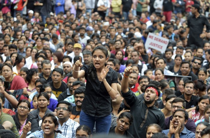 a number of indians can be seen protesting violence against women photo reuters