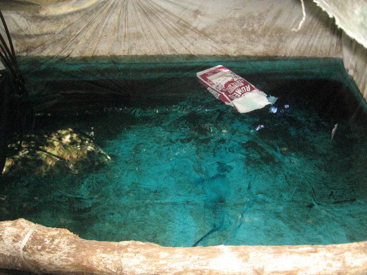 blue tinted water with fertilizer photo reuters