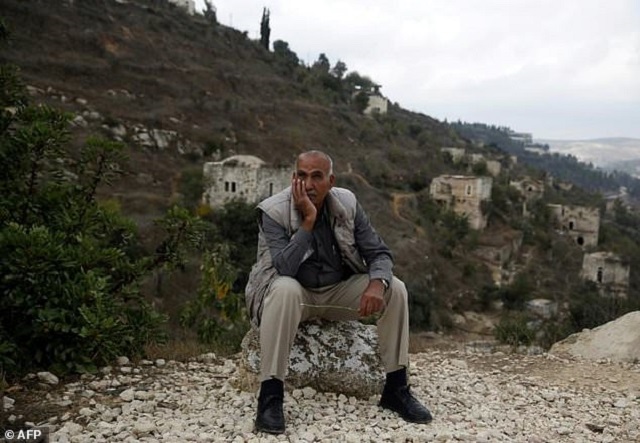 yacoub odeh a 77 year old palestinian sits by old houses in the ghost village of lifta whose palestinian inhabitants fled during fighting in the 1948 war surrounding the creation of israel photo afp