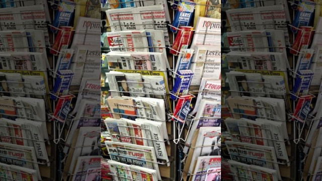 newspapers and magazines are seen in a kiosk in paris france photo reuters newspapers and magazines are seen in a kiosk in paris france photo reuters