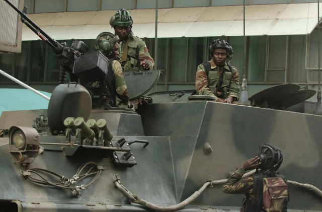 soldiers are seen on the armoured vehicle outside the parliament in harare zimbabwe photo reuters