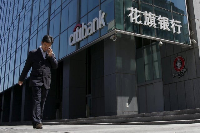 file photo a man walks past a branch of citibank in beijing china april 18 2016 photo reuters