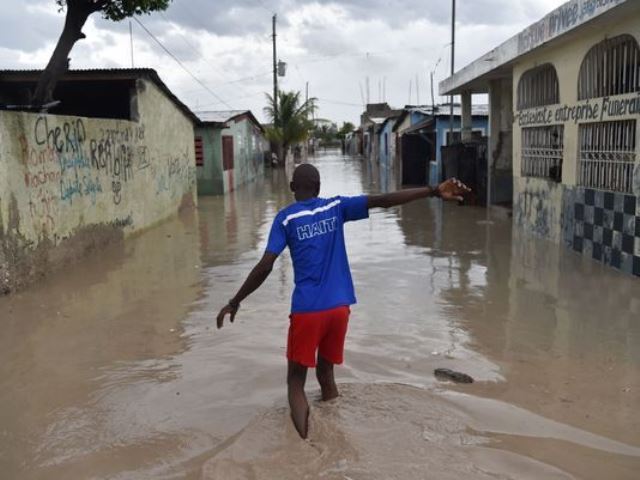 floods caused by two days of torrential rains have more than 10 000 homes inundated as well photo afp