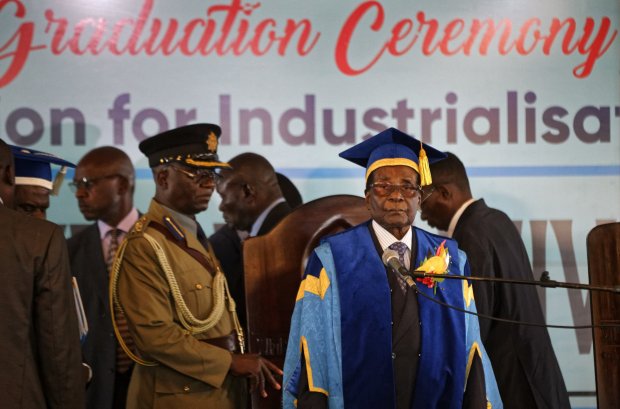 zimbabwe 039 s president robert mugabe center right arrives to preside over a student graduation ceremony at zimbabwe open university on the outskirts of harare zimbabwe photo afp