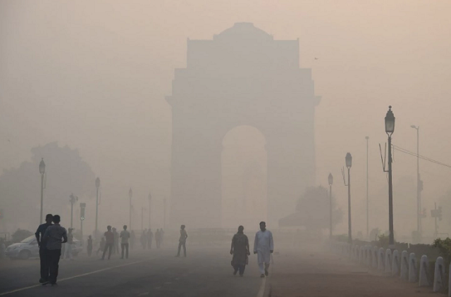 pedestrians walk near the india gate monument amid heavy smog in new delhi photo afp file pedestrians walk near the india gate monument amid heavy smog in new delhi photo afp file