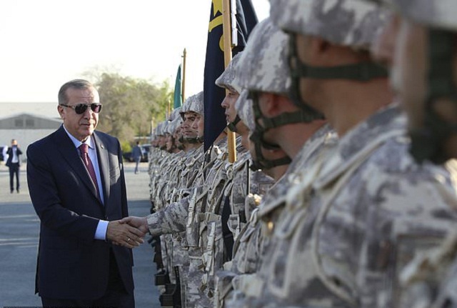 turkey 039 s president recep tayyip erdogan left shakes hands with turkish armed forces 039 s soldiers during his visit at the qatari turkish armed forces land command base in doha photo afp