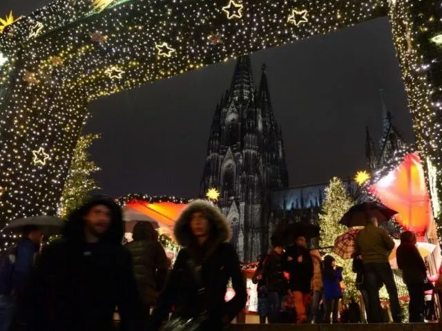 people walk through the entrance of a market in cologne germany during new year 039 s eve photo afp file people walk through the entrance of a market in cologne germany during new year 039 s eve photo afp file
