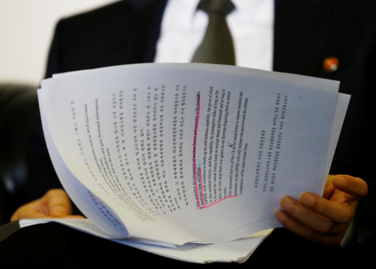 north korea 039 s ambassador to the united nations han tae song reads documents during an interview with reuters at the permanent mission of north korea in geneva switzerland november 17 2017 photo reuters